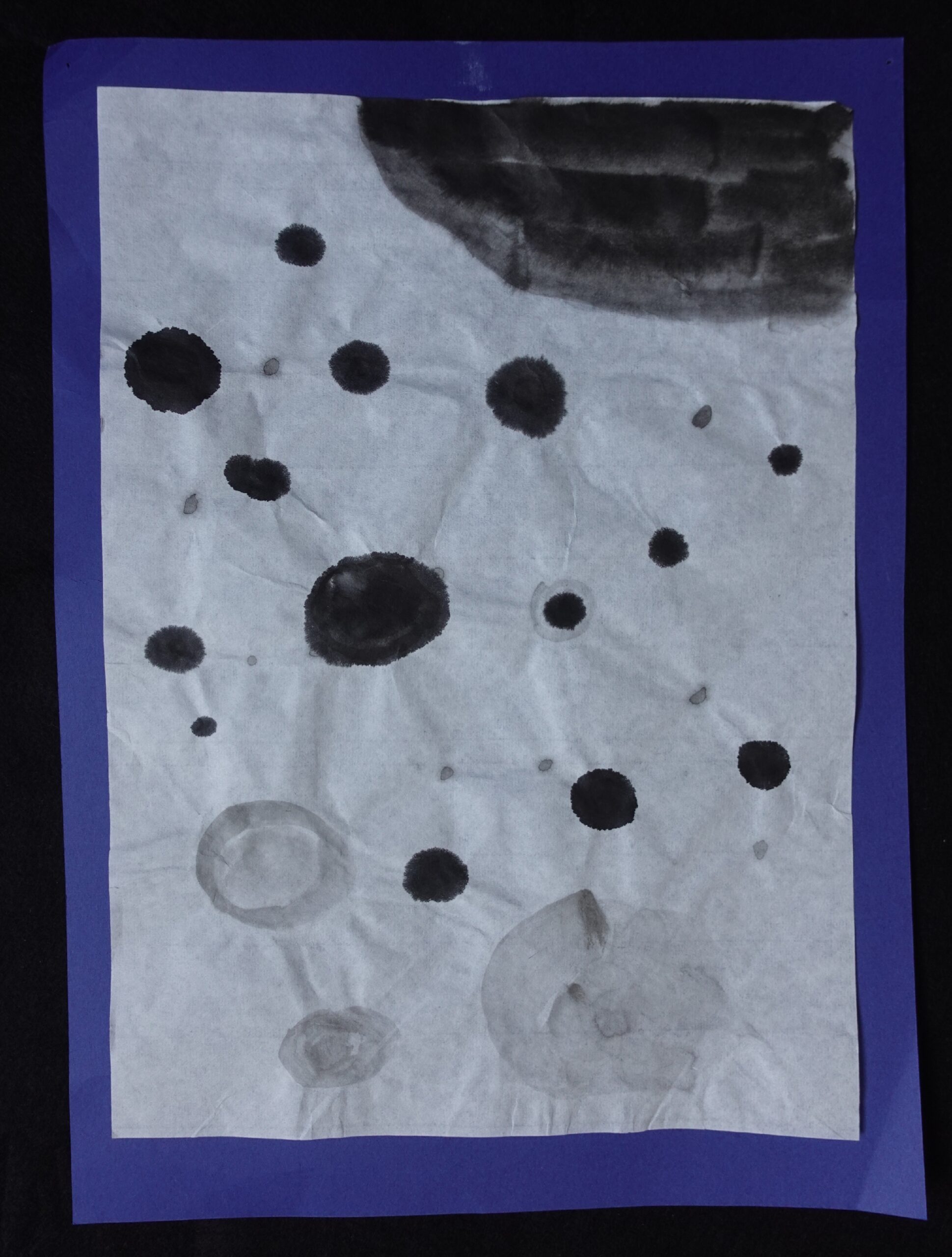 Abstract sumi-e style ink painting by a Japanese child, featuring dynamic black ink dots and washes on textured, crinkled white paper, mounted on a vibrant purple background. Ideal for minimalist wall decor.